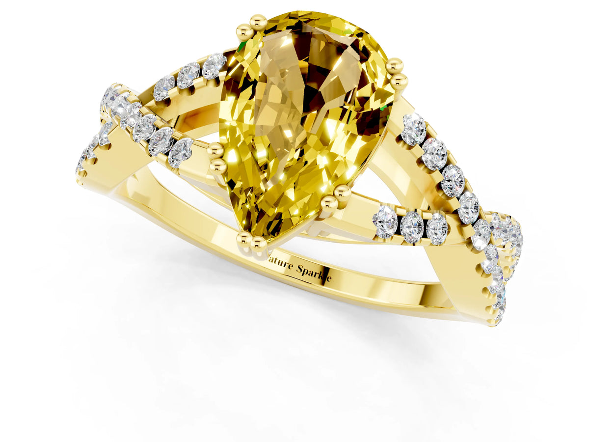 Pear Cut Yellow Sapphire Solitaire Ring in Yellow gold with Interwoven Pavé Band and Prong Setting_1