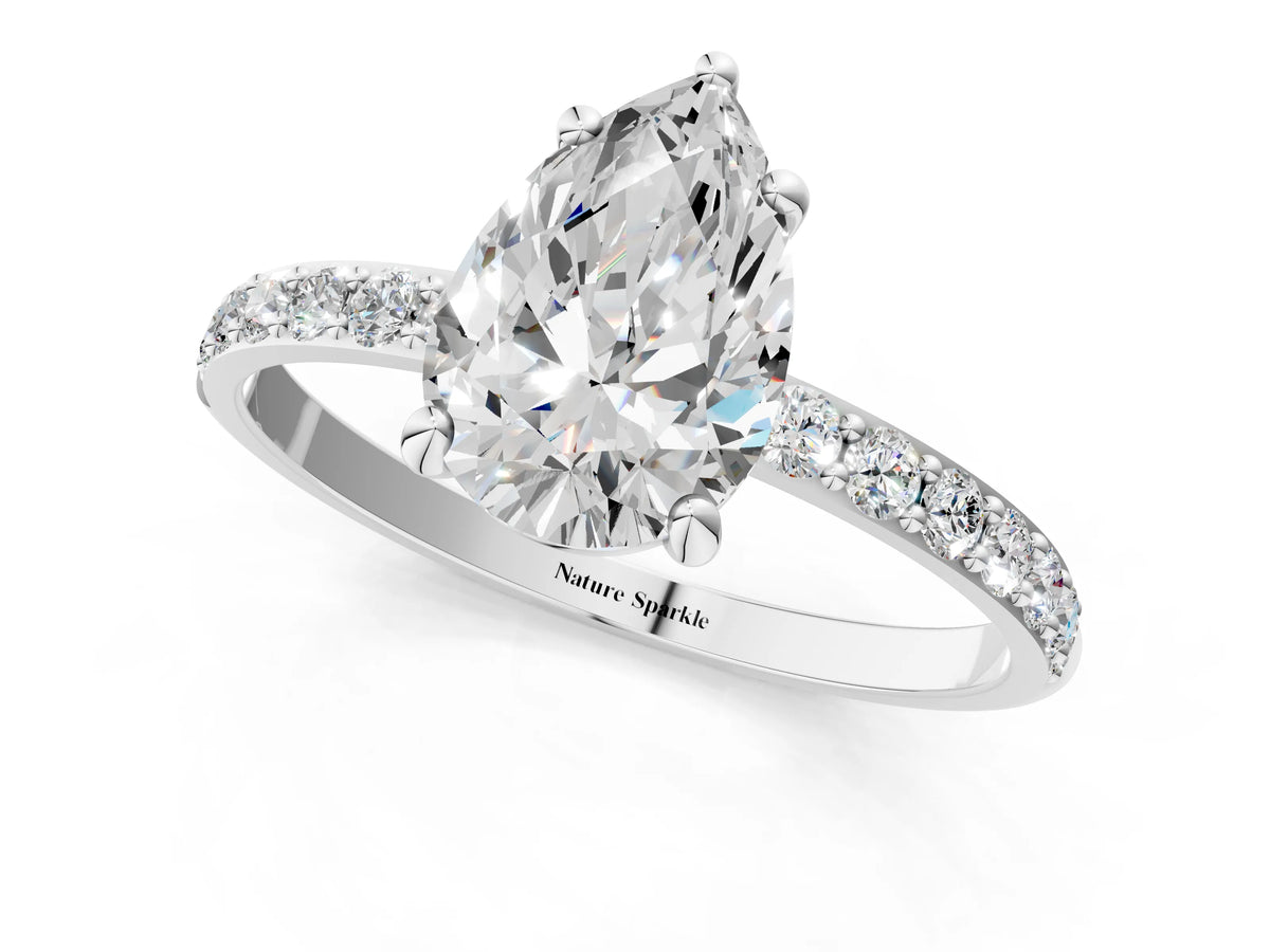 Platinum Pear Cut Diamond Solitaire Ring with Round Moissanite Pavé Band and Prong Setting_13