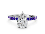 Platinum Pear Cut Diamond Solitaire Ring with Round Tanzanite Pavé Band and Prong Setting_12