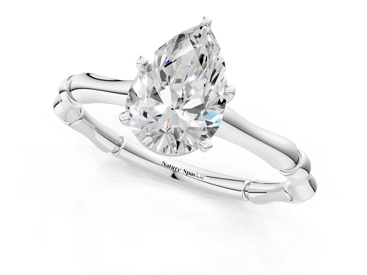 Platinum Pear Cut Solitaire Diamond Ring with Bamboo Band and Four-Prong Setting_13