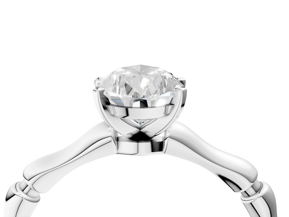 Platinum Pear Cut Solitaire Diamond Ring with Bamboo Band and Four-Prong Setting_16