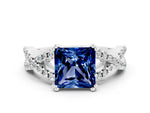 Princess Cut Blue Sapphire Solitaire Ring in White gold with Interwoven Pavé Band and Prong Setting