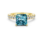 Princess Cut Blue Topaz Pavé Solitaire Ring in Yellow gold with Round Pavé Band and Prong Setting