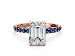 Rose gold Emerald Cut Diamond Solitaire Ring with Round Blue Sapphire Pavé Band and Prong Setting