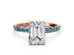 Rose gold Emerald Cut Diamond Solitaire Ring with Round Blue Topaz Pavé Band and Prong Setting