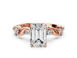 Rose gold Emerald Cut Diamond Solitaire Twisted Band with Round Accents and Prong Setting