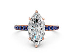 Rose gold Marquise Cut Diamond Solitaire Ring with Round Blue Sapphire Pavé Band and Prong Setting
