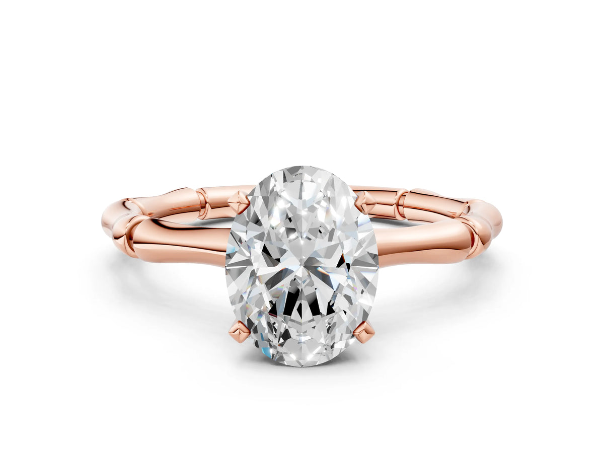 Rose gold Oval Cut Solitaire Diamond Ring with Bamboo Band and Four-Prong Setting