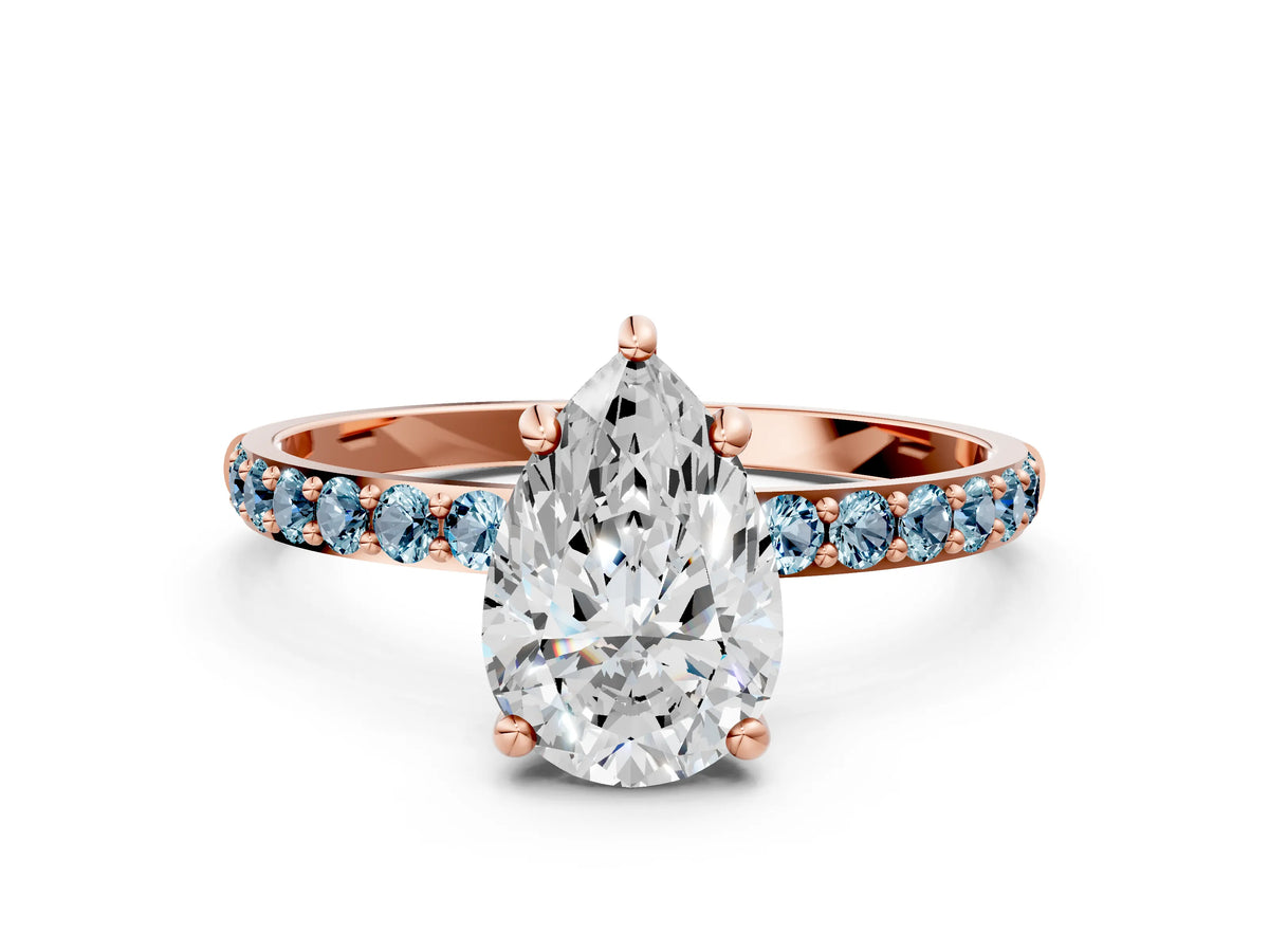 Rose gold Pear Cut Diamond Solitaire Ring with Round Aquamarine Pavé Band and Prong Setting