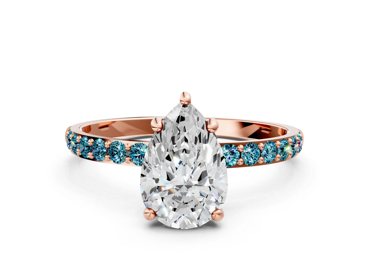 Rose gold Pear Cut Diamond Solitaire Ring with Round Blue Topaz Pavé Band and Prong Setting
