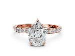 Rose gold Pear Cut Diamond Solitaire Ring with Round Moissanite Pavé Band and Prong Setting