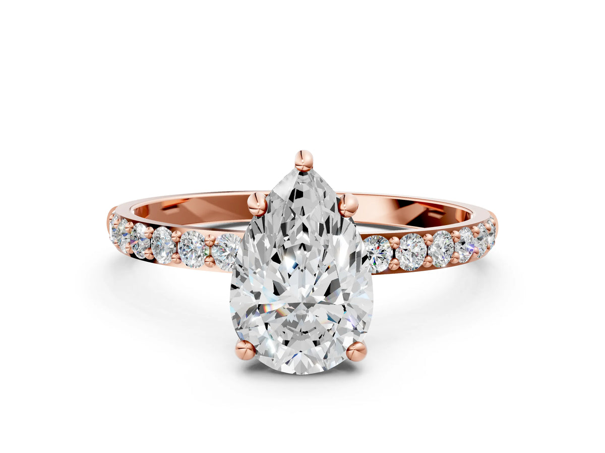 Rose gold Pear Cut Diamond Solitaire Ring with Round Moissanite Pavé Band and Prong Setting