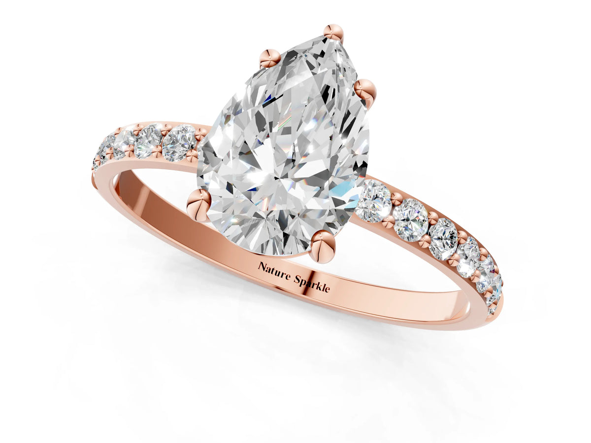 Rose gold Pear Cut Diamond Solitaire Ring with Round Moissanite Pavé Band and Prong Setting_1