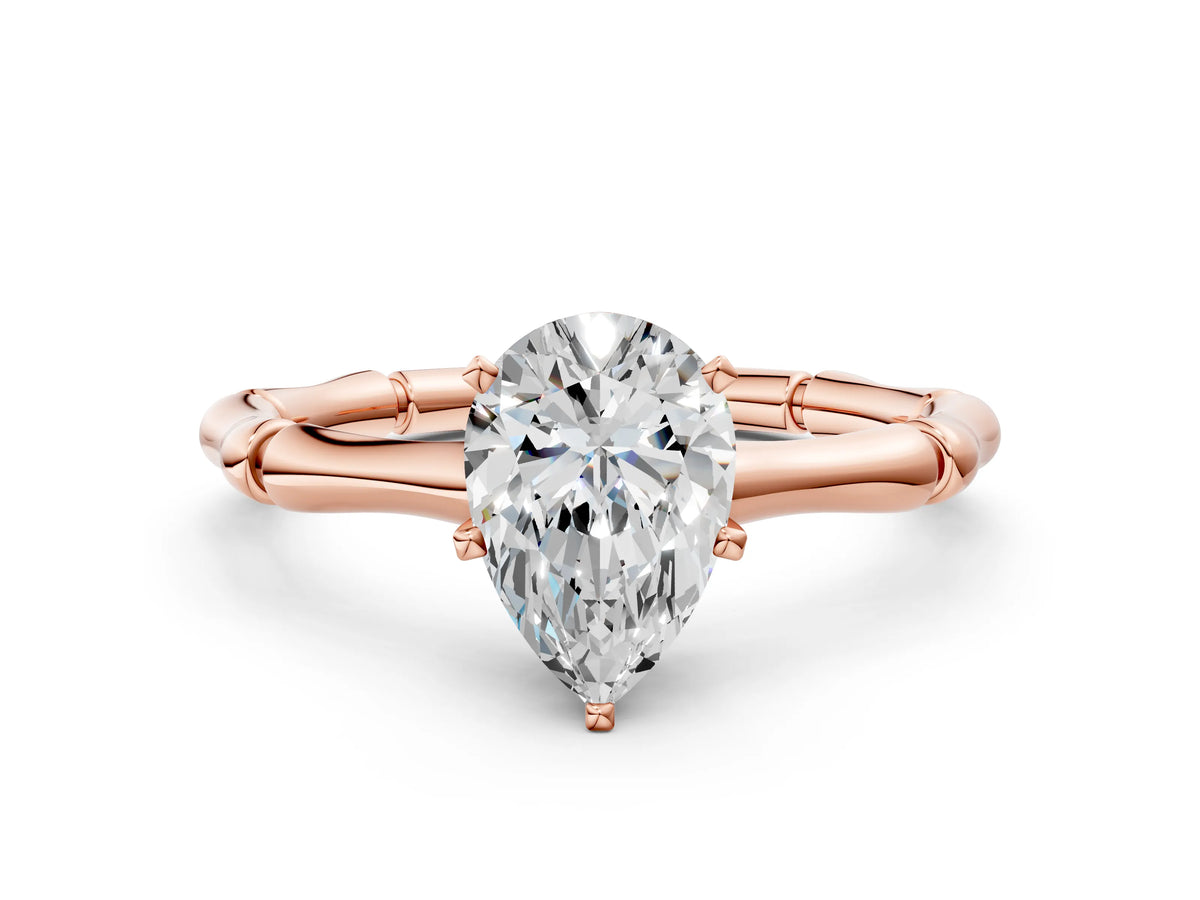 Rose gold Pear Cut Solitaire Diamond Ring with Bamboo Band and Four-Prong Setting