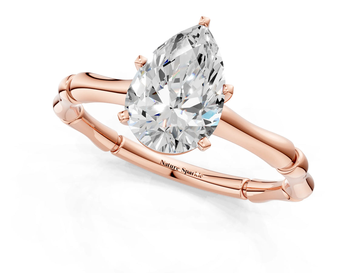 Rose gold Pear Cut Solitaire Diamond Ring with Bamboo Band and Four-Prong Setting_1