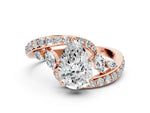 Rose gold Pear Cut Solitaire with Pavé Twist Band and Four-Prong Setting