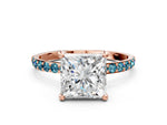 Rose gold Princess Cut Diamond Solitaire Ring with Round Blue Topaz Pavé Band and Prong Setting