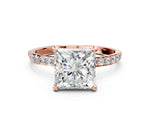 Rose gold Princess Cut Diamond Solitaire Ring with Round Moissanite Pavé Band and Prong Setting