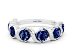 Round Blue Sapphire Half Eternity Band in Platinum with Wave Prong Setting