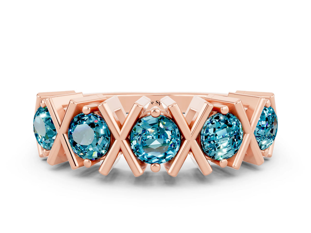 Round Blue Topaz Channel Set Band in Rose gold with X-Prong Detail