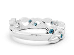 Round Blue Topaz Leaf Motif Eternity Band in White gold with Bezel Setting