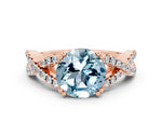 Round Cut Aquamarine Solitaire Ring in Rose gold with Interwoven Pavé Band and Prong Setting