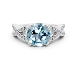Round Cut Aquamarine Solitaire Ring in White gold with Interwoven Pavé Band and Prong Setting