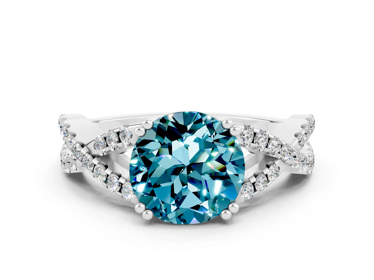 Round Cut Blue Topaz Solitaire Ring in White gold with Interwoven Pavé Band and Prong Setting