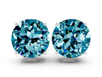Round Cut Blue Topaz Stud Earrings in White gold with Basket Setting