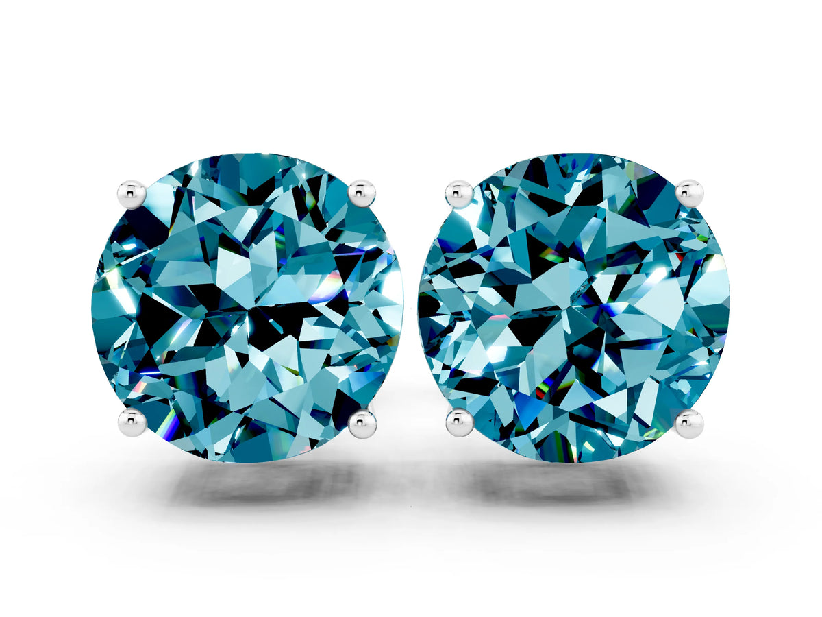 Round Cut Blue Topaz Stud Earrings in White gold with Basket Setting