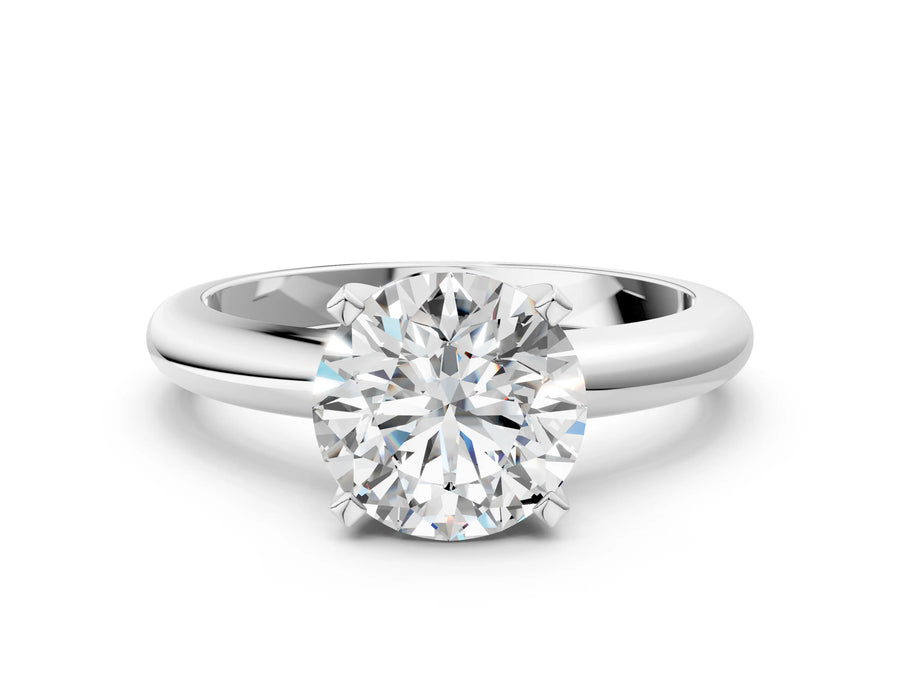 Round Cut Diamond Solitaire Ring in Silver with Prong Setting and Rounded Band