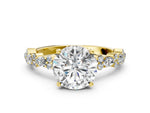 Round Cut Diamond Solitaire Ring in Yellow gold with Pear and Round Cluster Band
