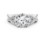 Round Cut Moissanite Solitaire Ring in White gold with Interwoven Pavé Band and Prong Setting