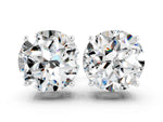 Round Cut Moissanite Stud Earrings in White gold with Basket Setting