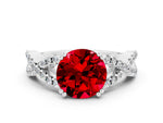 Round Cut Ruby Solitaire Ring in White gold with Interwoven Pavé Band and Prong Setting