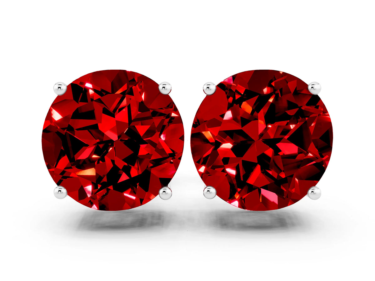 Round Cut Ruby Stud Earrings in White gold with Basket Setting
