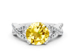 Round Cut Yellow Sapphire Solitaire Ring in White gold with Interwoven Pavé Band and Prong Setting