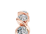 Round Moissanite Wave Band in Rose gold with Channel Setting and Shared Prongs_5