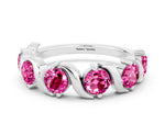 Round Pink Sapphire Half Eternity Band in Platinum with Wave Prong Setting