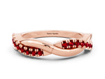 Round Ruby Twisted Infinity Band in Rose gold with Prong Setting