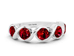 Round Ruby Wave Band in Platinum with Channel Setting and Shared Prongs