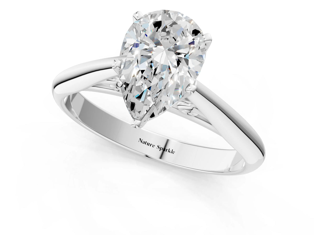 Silver Pear Cut Diamond Solitaire Engagement Ring with Cathedral Setting and Four-Prong Mount_13