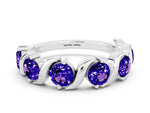 Six-Stone Round Tanzanite Wave Band in Platinum with Shared Prong Setting