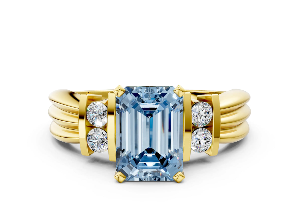 Three-Stone Fancy Blue Emerald Cut Diamond Channel Set Ring in Yellow gold with Bar Prongs