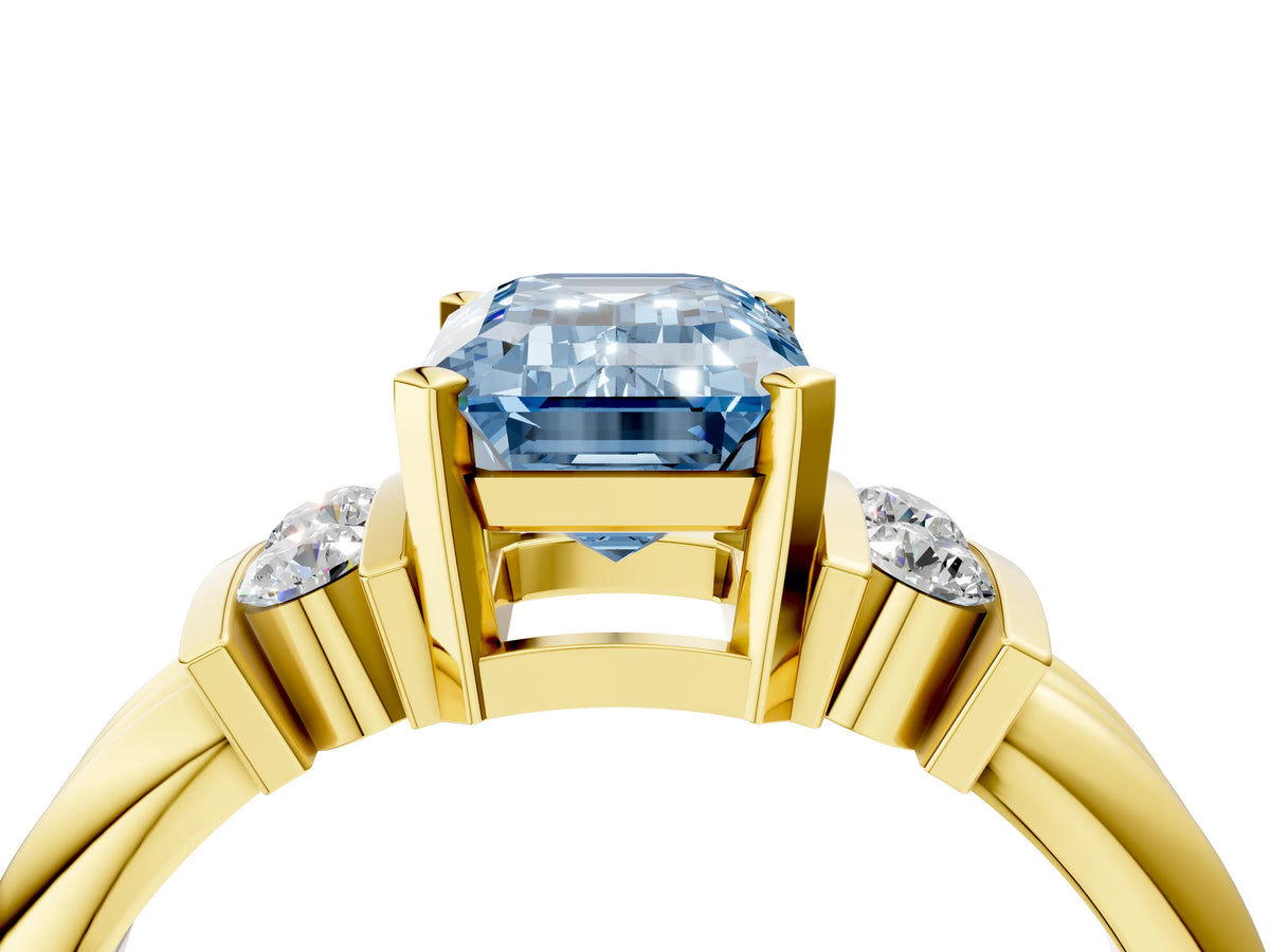 Three-Stone Fancy Blue Emerald Cut Diamond Channel Set Ring in Yellow gold with Bar Prongs_4