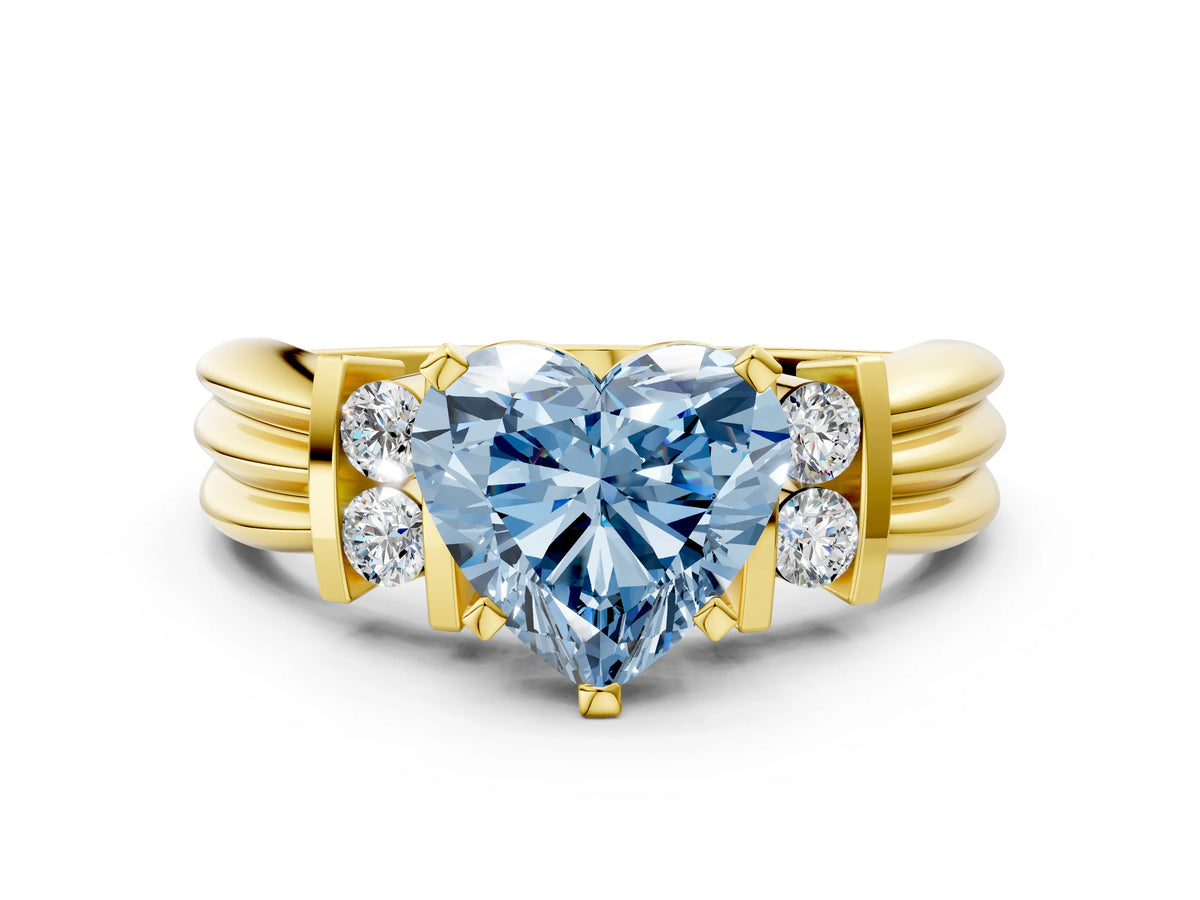Three-Stone Fancy Blue Heart Cut Diamond Channel Set Ring in Yellow gold with Bar Prongs