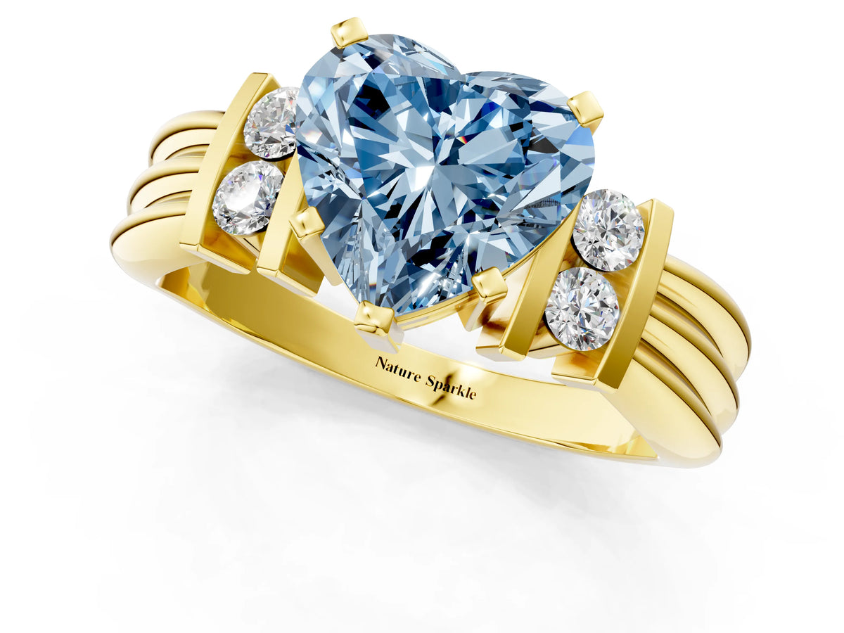 Three-Stone Fancy Blue Heart Cut Diamond Channel Set Ring in Yellow gold with Bar Prongs_1