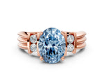 Three-Stone Fancy Blue Oval Cut Diamond Channel Set Ring in Rose gold with Bar Prongs
