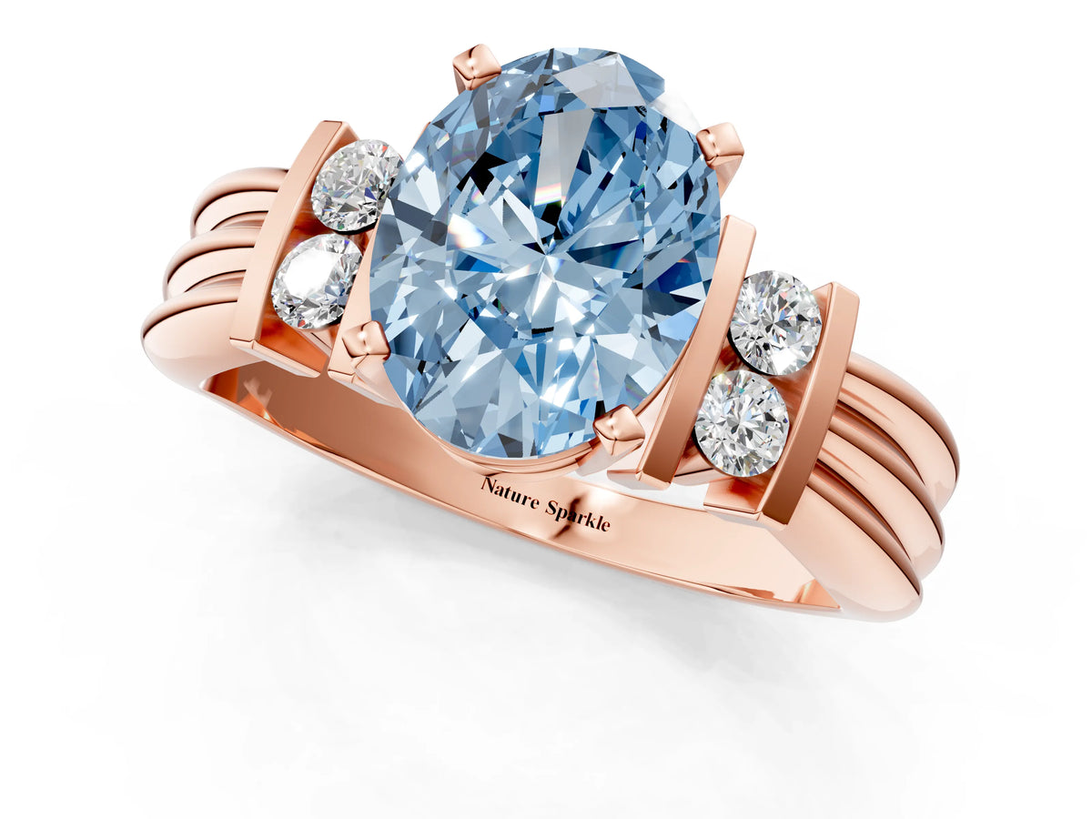 Three-Stone Fancy Blue Oval Cut Diamond Channel Set Ring in Rose gold with Bar Prongs_1