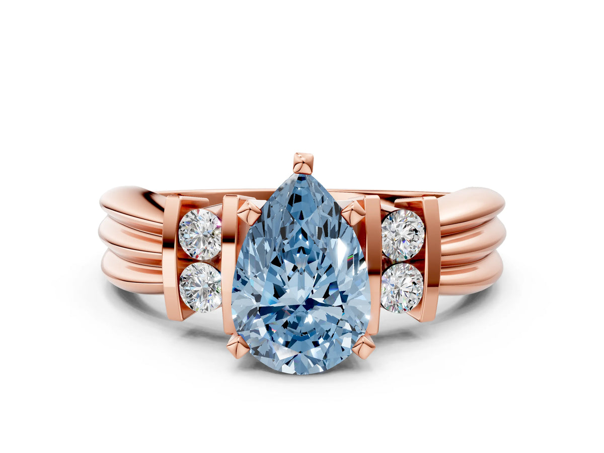 Three-Stone Fancy Blue Pear Cut Diamond Channel Set Ring in Rose gold with Bar Prongs